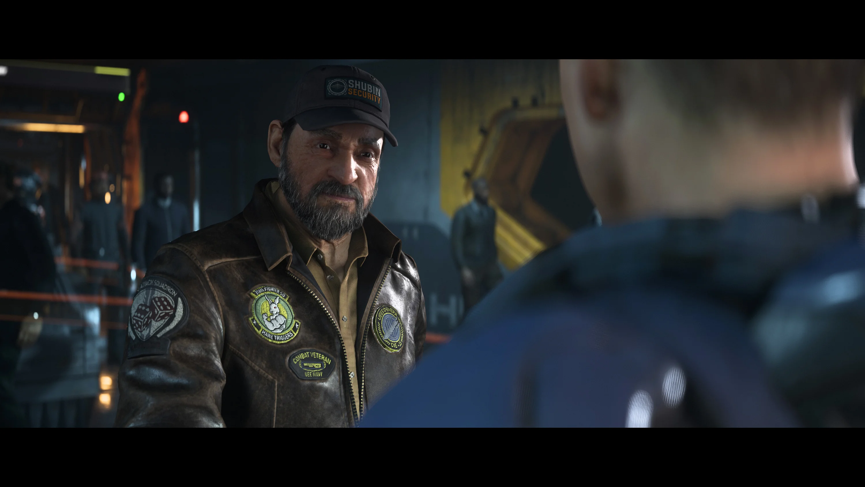 Older pilot wearing a patched leather jacket